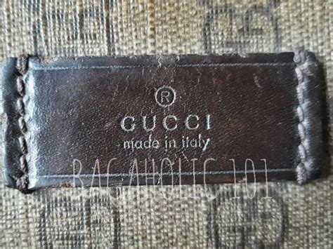 brown gucci made in italy tag on a bag